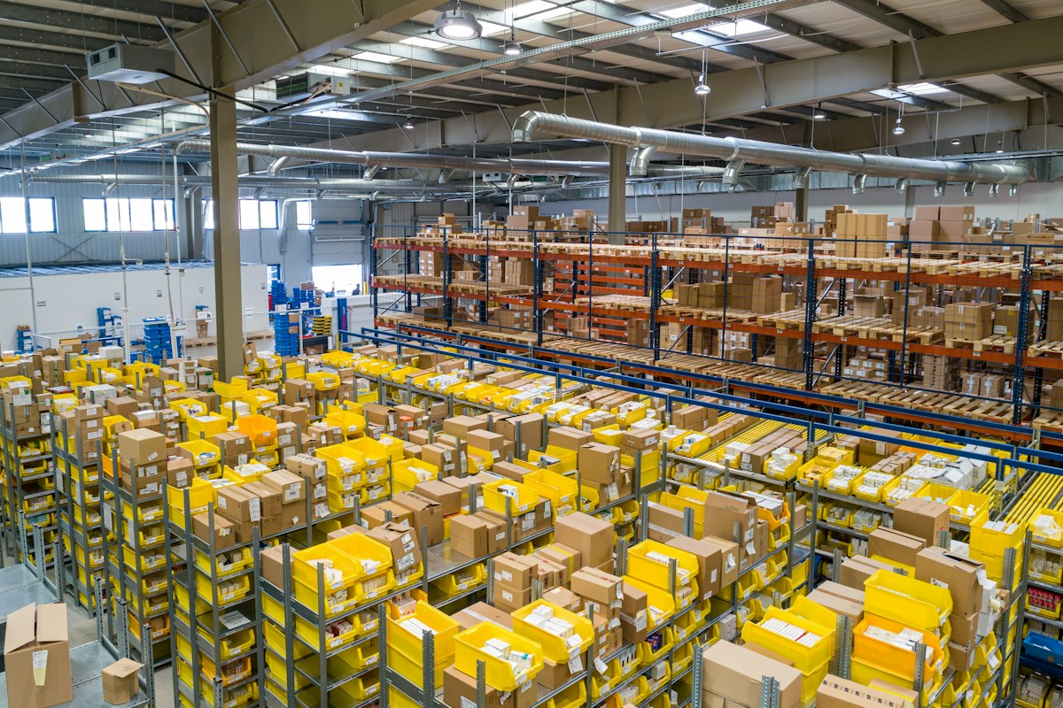 A stocked fulfilment warehouse with shelves of orders ready for dispatch